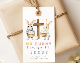 Puede incluir: Etiqueta de regalo de Pascua con dos conejos que sostienen cestas de huevos. La etiqueta tiene una cruz de madera y el texto "No bunny loves you like Jesus. Happy Easter love the Edwards."