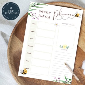 May include: A printable weekly prayer planner featuring a bee and floral design. The planner includes space for prayer goals, notes, and daily prayer entries. The text on the planner reads "Weekly Prayer Planner".