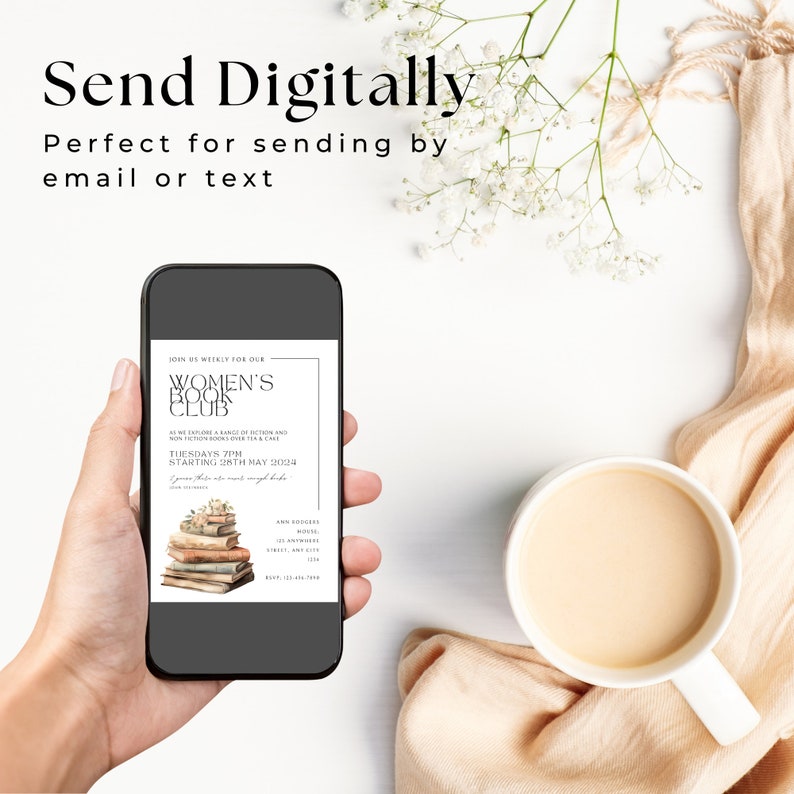 May include: A smartphone displays a digital invitation for a Women's Book Club, with text and a stack of books. The phone is held next to a cup of coffee and a beige cloth, with white flowers in the background. The text reads "Send Digitally".