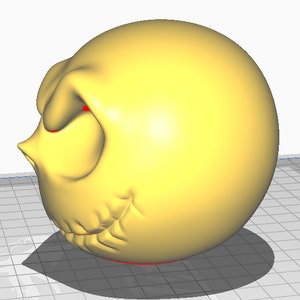 May include: A yellow 3D printed model of a cartoon face with a frown and red eyes. The model is printed in a smooth, glossy finish.