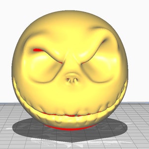 May include: A yellow 3D printed model of Jack Skellington's face from the movie The Nightmare Before Christmas. The model has a wide grin with sharp teeth and red eyes.