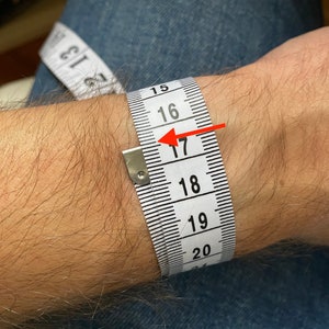 Prayer Wristband Features enamel filled “engraved” Orthodox ICXCNIKA Cross Jesus Fish, The Christ Christogram & Jesus Prayer "Lord Jesus Christ Have Mercy On Me" in English, Greek & Russian.