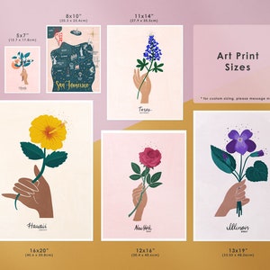 May include: A set of art prints featuring different flowers and states. The prints are available in various sizes, including 5x7 inches, 8x10 inches, 11x14 inches, 12x16 inches, 13x19 inches, and 16x20 inches. The prints feature a hand holding a flower, with the state name and flower type listed below. The text "Art Print Sizes" is displayed at the top of the image, with the note "*for custom sizing, please message me!" below.