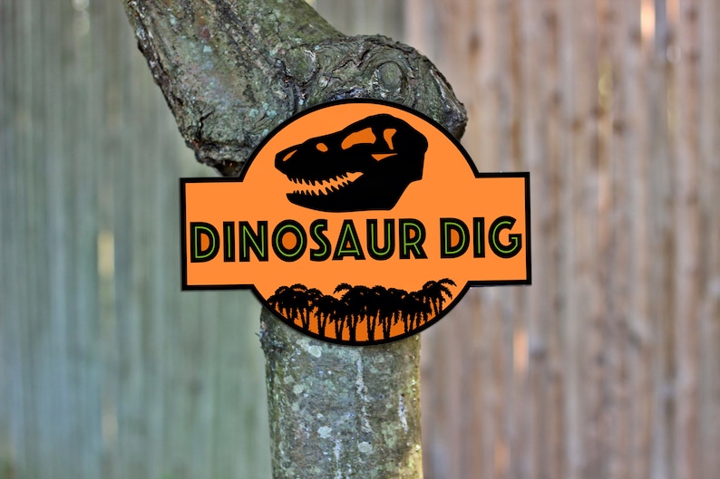 May include: Orange sign with a dinosaur skull and palm trees, reading "Dinosaur Dig".