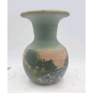 May include: A handcrafted, small, green vase with a wide, flared rim. The vase has a rounded body with a textured, painted design in shades of green, tan, and blue. The vase is approximately 6 inches tall.