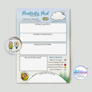 May include: A Positivity Pad in light blue and white, featuring the text "Positivity Pad" and "Mindful Me". It has sections for gratitude, goals, and affirmations. A round pin with a lightbulb and battery graphic is also visible.