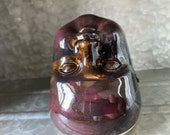 Upside down ceramic baby head