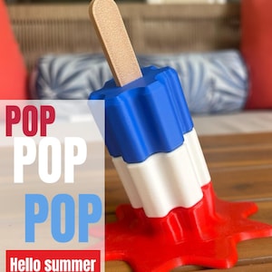 Melted bomb pop summer, lots of Beachy vibes, nice cake topper, vibrant colors, great gift