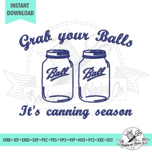 May include: Embroidered design featuring two blue mason jars with the word "Ball" on them. The text "Grab your Balls It's canning season" is written in blue cursive lettering.