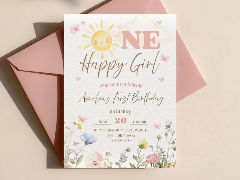 May include: A light-colored invitation card with the text "ONE Happy Girl" and "Amelia's First Birthday". The card features a smiling sun, butterflies, and floral illustrations. A pink envelope is in the background.
