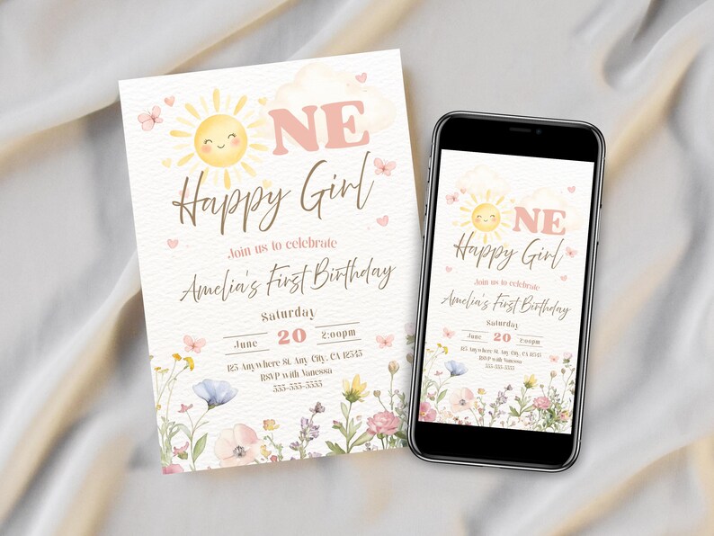 May include: A birthday invitation and a smartphone displaying the same design. The invitation features a smiling sun, the words "Happy Girl," and floral accents. The text reads "Amelia's First Birthday" and includes date and time.
