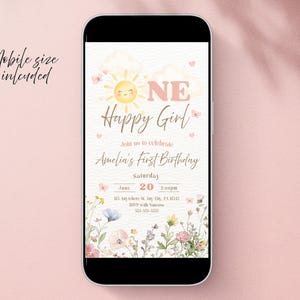May include: A mobile phone displays a digital invitation for Amelia's first birthday. The design features a smiling sun, floral accents, and the text "Happy Girl." The invitation includes the date, time, and location.