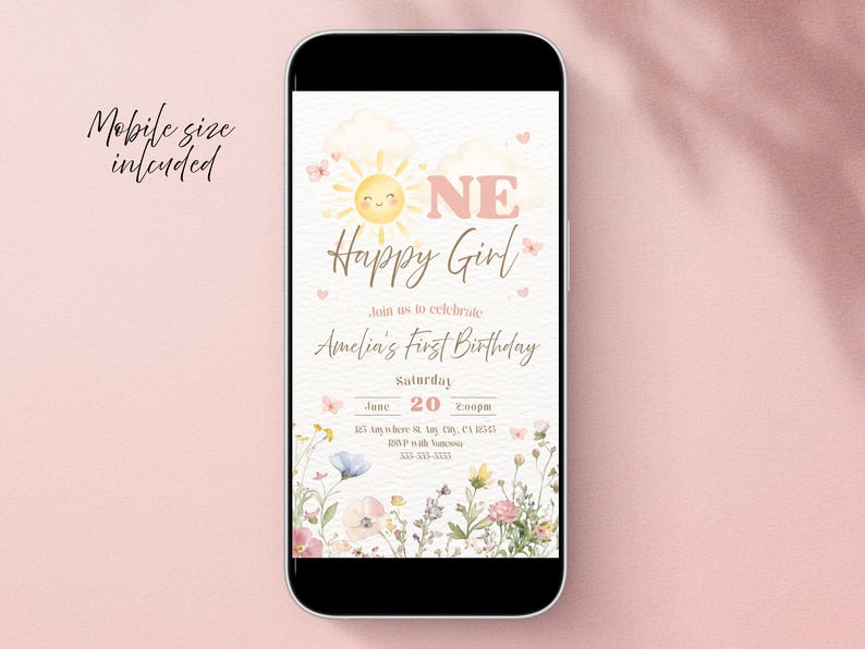 May include: A mobile phone displays a digital invitation for Amelia's first birthday. The design features a smiling sun, floral accents, and the text "Happy Girl." The invitation includes the date, time, and location.