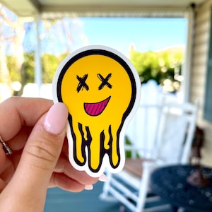Melting smiley face sticker