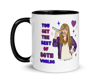 May include: White ceramic coffee mug with a black rim and handle. The mug features a cartoon illustration of a singer holding a microphone with the text "You Get The Best Of Both Worlds" printed on the mug.