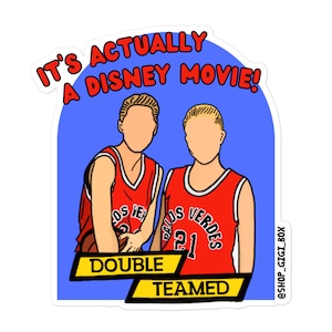 May include: A sticker with a blue background and two cartoon basketball players wearing red jerseys. The text "It's actually a Disney movie!" is at the top of the sticker. The text "Double Teamed" is at the bottom of the sticker.