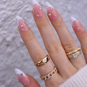 Medium, almond shape, press-on nails with French tip and diamonds / diamontes