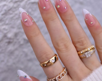 Medium, almond shape, press-on nails with French tip and diamonds / diamontes