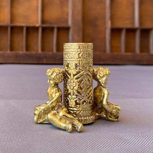 Cherub Lipstick Or Perfume Bottle Holder. Stylebuilt Accessories. Filigree. Gold Toned.  Vanity Decor. Victorian Style. NY. 1960s.