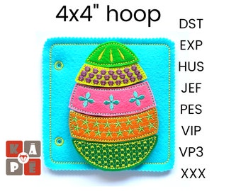May include: A 4x4 inch felt hoop with an embroidered Easter egg design. The egg is made up of five layers of felt in different colors and patterns, including green, pink, orange, and yellow. The hoop is perfect for a craft project or a decorative piece.