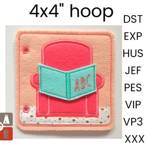 May include: A 4x4 inch embroidery hoop with a pink felt chair and a turquoise book with the letters ABC on it. The chair is sitting on a white felt base with gold stars.
