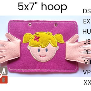 May include: A pink felt 5x7 inch hoop with a girl's face and two hands on either side. The girl has blonde hair and a pink flower. The hands are pink and have five fingers. The hoop is stitched with white thread. The text "5x7" hoop is at the top of the image. The text "DST", "EXP", "HUS", "JEF", "PES", "VIP", "VP3", and "XXX" is on the right side of the image.