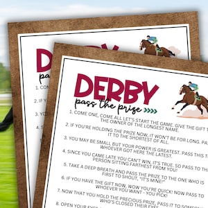 May include: A printable game card with a brown woodgrain background and a red and white title that says "Derby Pass the Prize". The card has instructions for a game where players pass a gift around a circle.