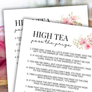 May include: Two white sheets of paper with the text "HIGH TEA pass the prize" in black script. The top right corner of the paper is decorated with pink floral illustrations. The text includes instructions for a game.