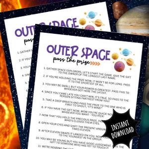 May include: A printable game card with a purple and white outer space theme. The card has instructions for a game called "Outer Space Pass the Prize" with a series of instructions for passing a prize around a group of people. The card has a black background with colorful planets and stars.