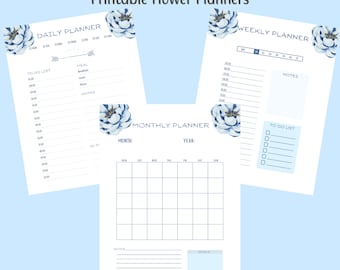 May include: Three printable planner pages titled Printable Flower Planners, featuring a daily planner, a weekly planner, and a monthly planner. Each white page is decorated with blue floral illustrations and includes organized sections for tasks, notes, and scheduling.