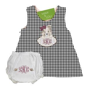 May include: A black and white gingham baby dress and nappy cover set. The dress features an embroidered puppy on a football with the initials "KRC". The nappy cover is white with lace trim and matching initials and footballs. The tag reads "MIMI & LOU".