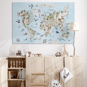 May include: A light blue world map with watercolor illustrations of animals and ocean life. The map includes the text "CARTE DU MONDE" in a banner at the top.