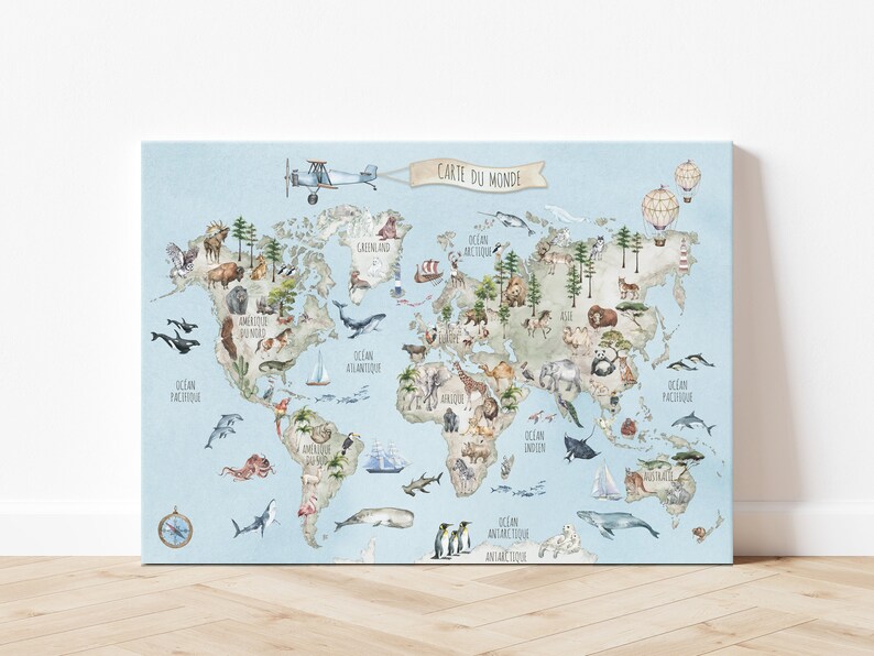 May include: A blue and white world map with animals and text in French. The map includes the text "Carte du Monde" and shows the continents of North America, South America, Europe, Asia, Africa, Australia, and Antarctica. The map is surrounded by a light blue border.