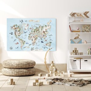 May include: A light blue world map with illustrations of animals and plants from different continents. The map is printed on canvas and has the text "Carte du Monde" at the top. The map is hanging on a white wall in a room with a wooden floor and a white bookshelf with wooden shelves.