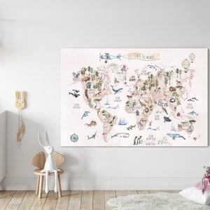 May include: A pink and beige world map with watercolor illustrations of animals and plants. The map is titled "Carte du Monde" and is displayed on a white wall in a nursery.