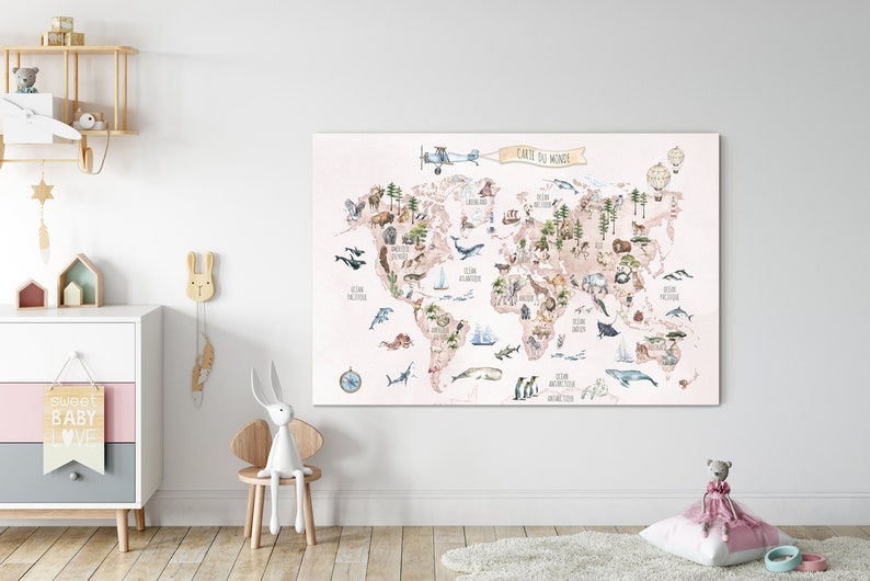 May include: A pink and beige world map with watercolor illustrations of animals and plants. The map is titled "Carte du Monde" and is displayed on a white wall in a nursery.