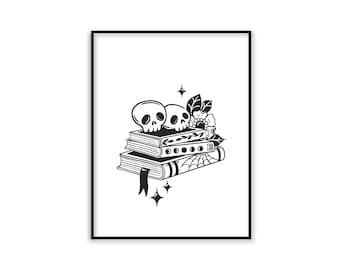 May include: Black and white illustration of two skulls on top of a stack of books with a floral design. The books have a spiderweb design on the bottom book.