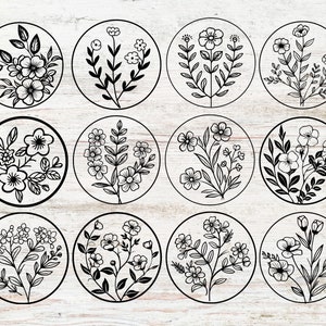 May include: Twelve black and white floral designs in circular frames. Each design features a different arrangement of flowers and leaves.