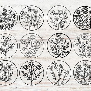 May include: Twelve black and white illustrations of different floral designs. Each design is enclosed in a circle and features various types of flowers and leaves.