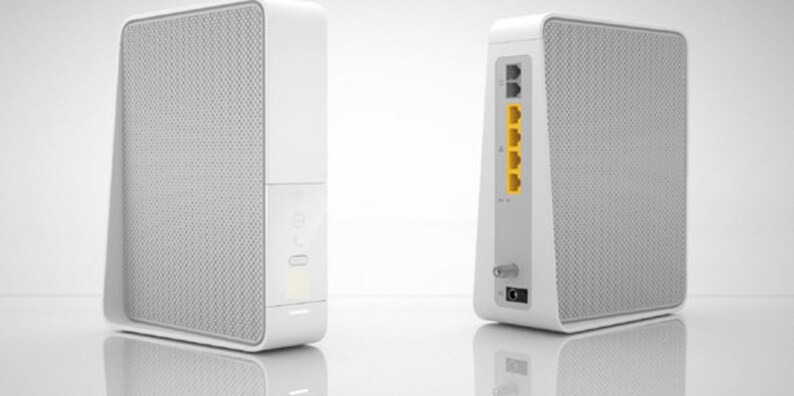 Puede incluir: Un router inal&aacute;mbrico blanco con una superficie texturizada y varios puertos en la parte posterior. El router est&aacute; dise&ntilde;ado para colocarse verticalmente.