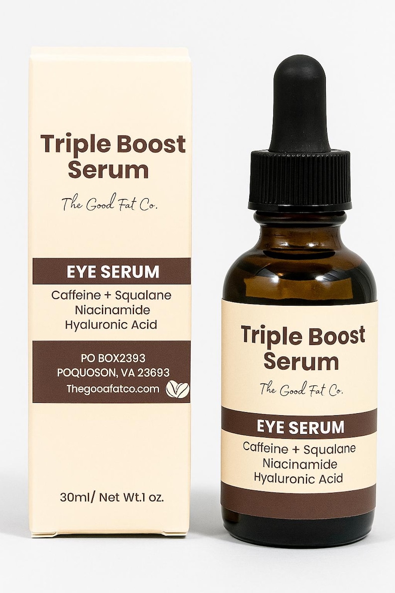 May include: A brown glass bottle and a box of Triple Boost Eye Serum by The Good Fat Co. The bottle has a black dropper and the box lists ingredients: Caffeine, Squalane, Niacinamide, and Hyaluronic Acid. The product is 1 fl oz.