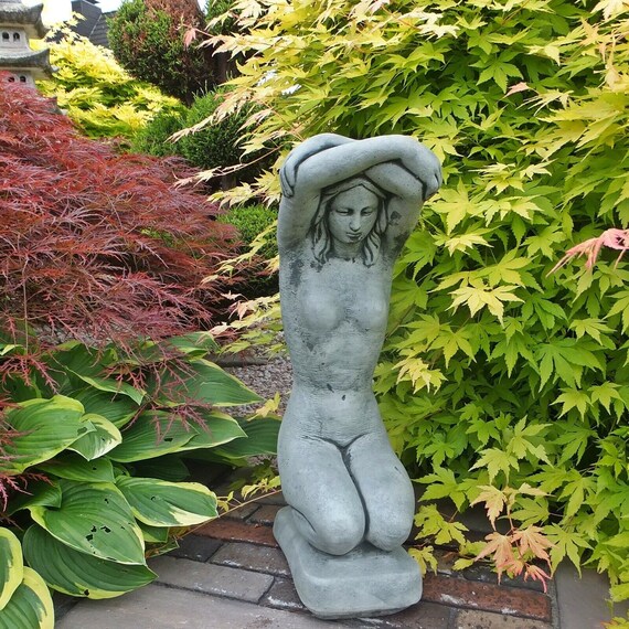 Naked Woman In The Garden
