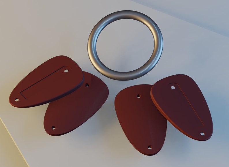 May include: Four brown guitar pickguards with a silver ring. The pickguards have a rounded shape with a slot in the center and two small holes on either side.
