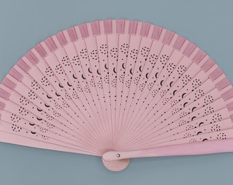 Fan with artistic openings