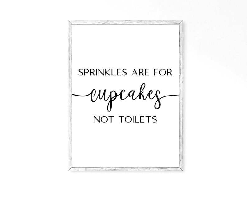 May include: White framed print with black text that reads "Sprinkles are for cupcakes not toilets".
