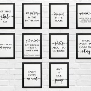 May include: Ten black framed prints with white backgrounds and black text. The prints feature humorous bathroom-themed sayings, such as "Let that shit go", "No selfies in the bathroom", "Best seat in the house", "Get naked", "I was full of shit, not anymore", "Get naked, just kidding, this is a half bath", "Shits about to go down", "I hope everything comes out okay", "Enjoy every moment", and "Have a nice poop".