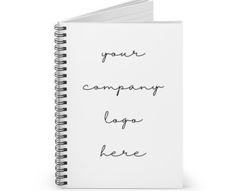 May include: A white spiral bound notebook with the text "your company logo here" written in black ink.