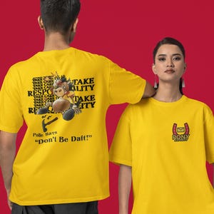 May include: Two yellow t-shirts. The back of one t-shirt features a cartoon bull with the text "Take Care" and "Take Responsibility" repeated multiple times. The text "Polle Says "Don't Be Daft!" is below the cartoon. The front of the other t-shirt features a small logo with a horseshoe and the text "Pony Express".