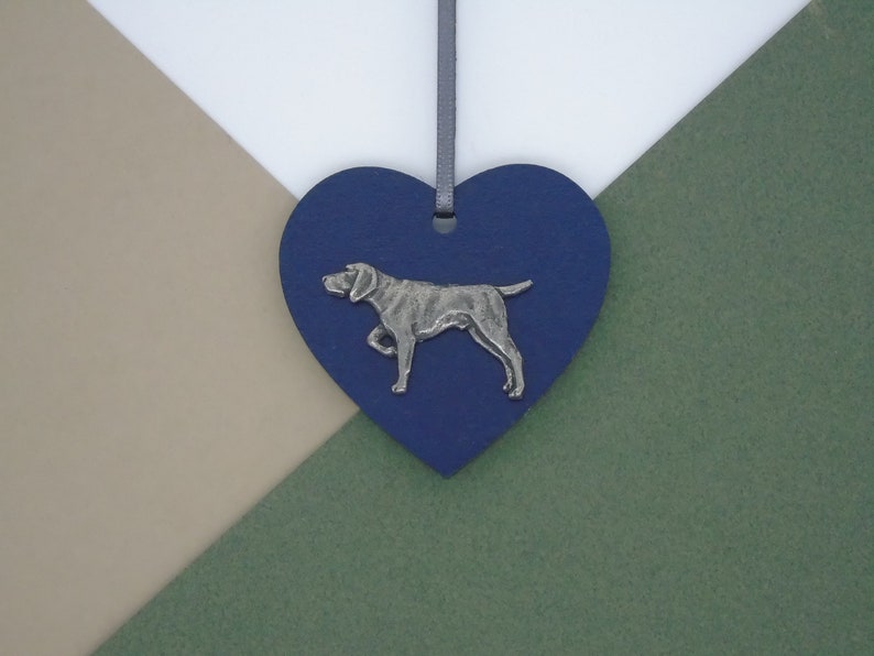 May include: A blue heart-shaped wooden ornament with a silver-colored German Shorthaired Pointer dog silhouette.