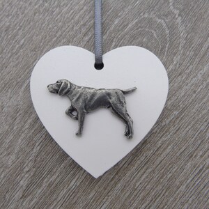 May include: White heart-shaped wooden ornament with a pewter German Shorthaired Pointer dog figurine.